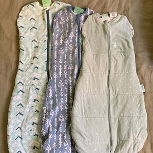 Three ergo pouch sleep sacks. 2.5 tog, 3-6 months. 1.0 tog, 3-12 months. 2.5 tog